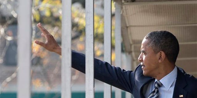 Nov. 6, 2012: Obama walks through a hallway on Election Day.