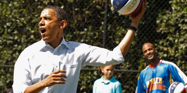 WASHINGTON, DC - APRIL 25: (AFP OUT) U.S. President Barack Obama shoots a basketball while participating in a "Let's Move" clinic with members of the NBA, WNBA and the Harlem Globetrotters during the White House Easter Egg Roll on the South Lawn of the White House April 25, 2011 in Washington, DC. About 30,000 people are expected to attend the 133-year-old tradition of rolling colored eggs down the White House lawn. (Photo by Chip Somodevilla/Getty Images)