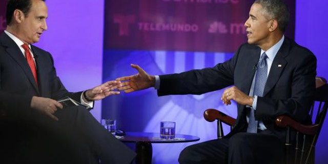 Feb. 26, 2015: U.S. President Barack Obama participates in the taping of an town hall discussion on immigration with host Jose Diaz-Balart at Florida International University in Miami. (Reuters/Jonathan Ernst)