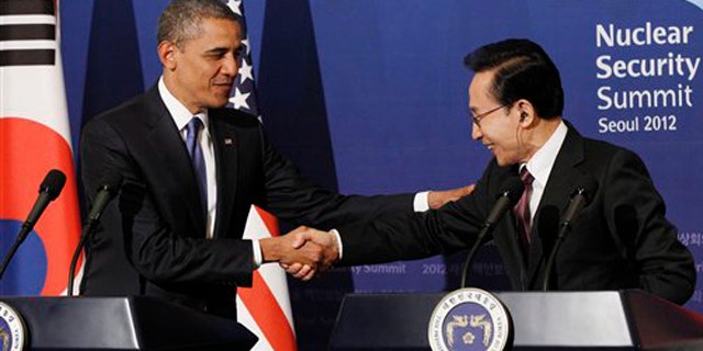 Mar. 25, 2012: U.S. President Barack Obama shakes hands with South Korean President Lee Myung-bak during their joint news conference at the presidential Blue House in Seoul.