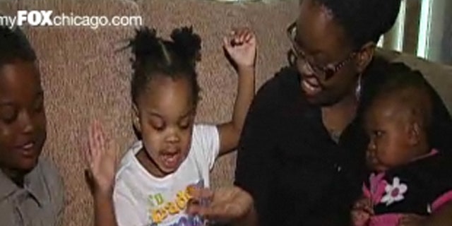 Destiny Mathis, seen here with her children, decided to sell the letter President Obama sent her to help pay bills.