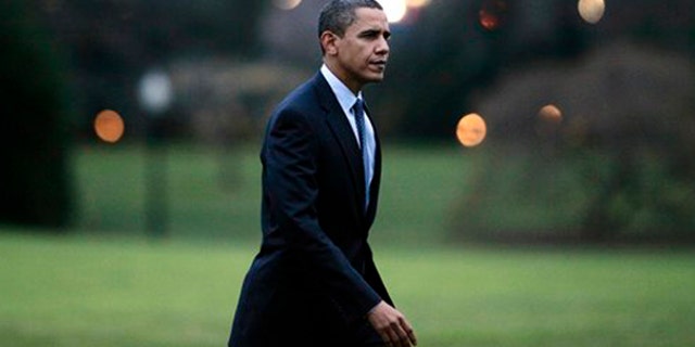 President Obama walks on the South Lawn of the White House in Washington, Friday, Dec. 4, 2009, after he returned from a trip to Allentown, Pa. (AP)