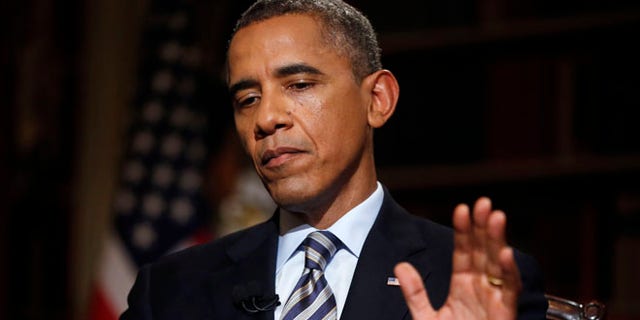 FILE: Oct. 4, 2013, President Obama during an interview with The Associated Press in the White House library in Washington, D.C.