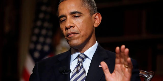 FILE: Oct. 4, 2013, President Obama during an interview with The Associated Press in the White House library in Washington, D.C.