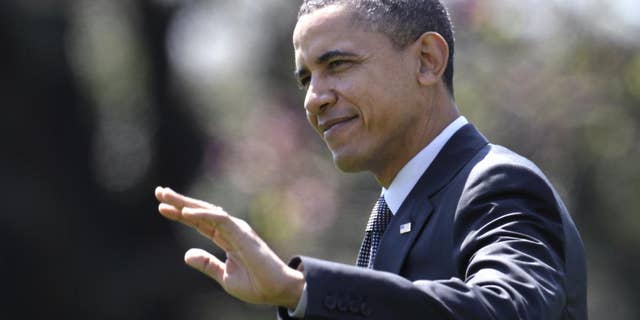 President Barack Obama waves as he walks across the South Lawn of the White House in Washington, Wednesday, April 6, 2011, to board Marine One as he travels to Pennsylvania. (AP Photo/Carolyn Kaster)