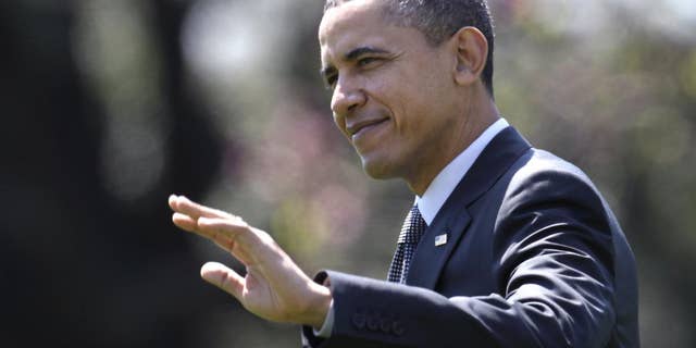 President Barack Obama waves as he walks across the South Lawn of the White House in Washington, Wednesday, April 6, 2011, to board Marine One as he travels to Pennsylvania. (AP Photo/Carolyn Kaster)