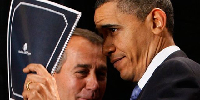 President Barack Obama holds up a document of Republican solutions given to him by House Minority Leader John Boehner of Ohio, before he spoke to Republican lawmakers at the GOP House Issues Conference in Baltimore, Friday, Jan. 29, 2010. (AP Photo/Charles Dharapak)