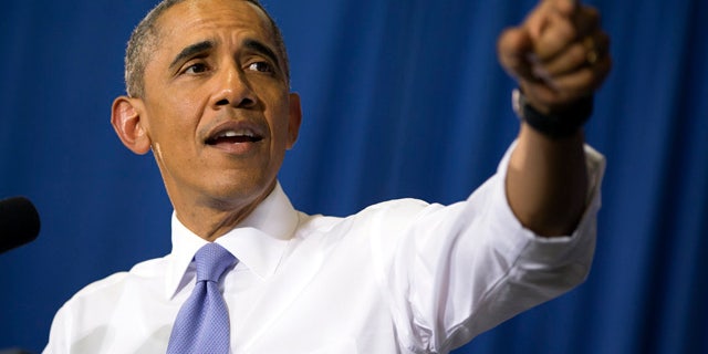 July 15, 2015: President Barack Obama speaks in the Choctaw Nation on economic opportunities for underprivileged communities across the nation in Durant, Okla. (AP Photo/Evan Vucci)