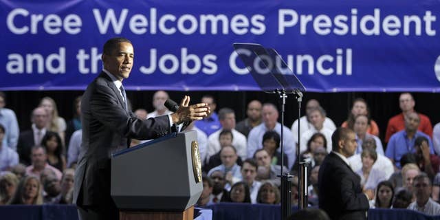 President Barack Obama speaks to employees and guests at Cree, Inc., a leading manufacturer of energy-efficient LED lighting, in Durham, N.C., Monday, June 13, 2011. (AP Photo/Chuck Burton)