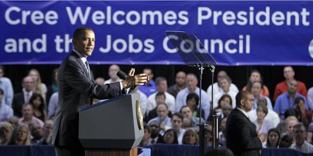 President Barack Obama speaks to employees and guests at Cree, Inc., a leading manufacturer of energy-efficient LED lighting, in Durham, N.C., Monday, June 13, 2011. (AP Photo/Chuck Burton)
