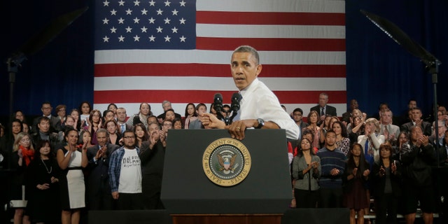President Obama responds to hecklers interrupting his speech about immigration reform, Monday, Nov. 25, 2013, at the Betty Ann Ong Chinese Recreation Center in San Francisco.