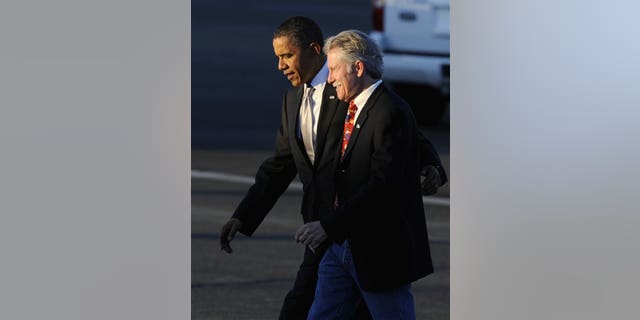 President Barack Obama walks with John Kitzhaber who is running for Oregon governor as he walks to greet supporters at Portland Air National Guard Base in Portland, Ore., Wednesday Oct 20, 2010. (AP Photo/Greg Wahl-Stephens)