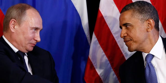 FILE: June 18, 2012: President Obama and Russian President Vladimir Putin, in Los Cabos, Mexico.