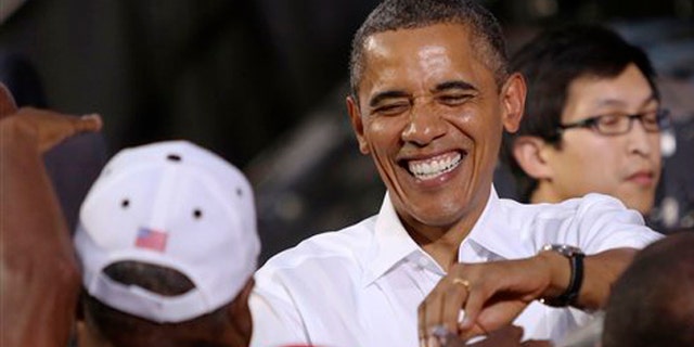 FILE: July 13, 2012: President Barack Obama greets supporters supporters following a rally in Roanoke, Va.