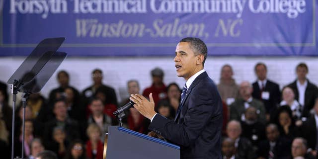 President Barack Obama gestures while speaking during a visit to Forsyth Technical Community College in Winston-Salem, N.C., Monday, Dec. 6, 2010. (AP Photo/Chuck Burton)