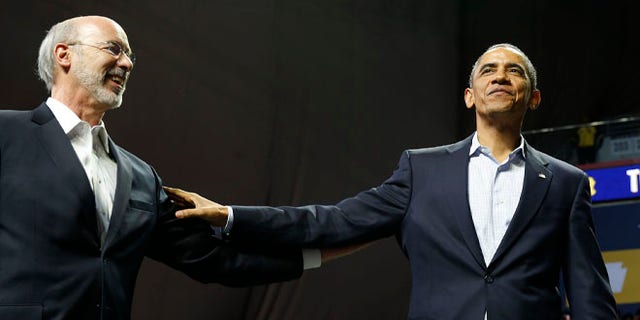 FILE: Nov. 2, 2014: President Obama with Tom Wolf, who is running for Pennsylvania governor, Temple University, Philadelphia, Pa.