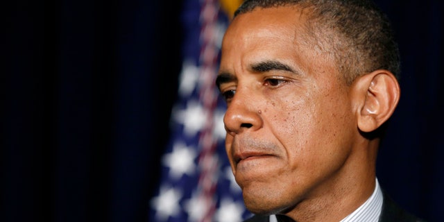 U.S. President Barack Obama makes a statement on the border crisis after his meeting with Texas Governor Rick Perry (not seen) in Dallas July 9, 2014. (REUTERS/Kevin Lamarque)