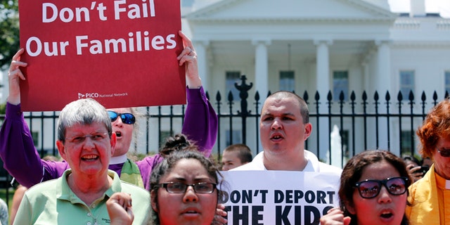 FILE: July 31, 2014: Church groups protest against President Obama's immigration policies outside the White House, Washington, D.C.