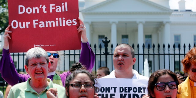 FILE: July 31, 2014: Church groups protest against President Obama's immigration policies outside the White House, Washington, D.C.