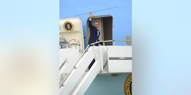 President Obama boards Air Force One/AP