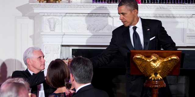 FILE: Feb. 23, 2014: President Obama and Gov. Mike Pence, R-Ind., in the White House, in Washington, D.C.