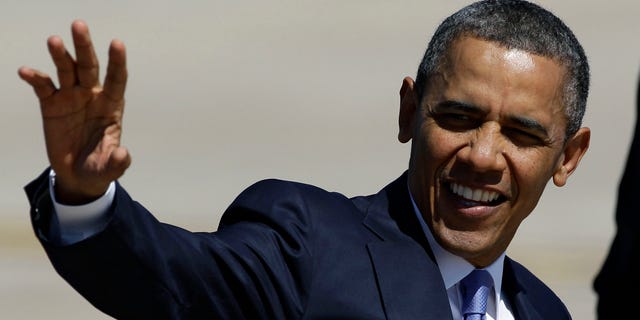 FILE: April 4, 2013: President Obama waves after his arrival at Buckley Air Force Base, Colo.
