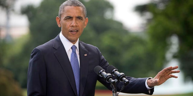 President Barack Obama talks about his administration's response to a growing insurgency foothold in Iraq, Friday, June 13, 2014, on the South Lawn of the White House in Washington.