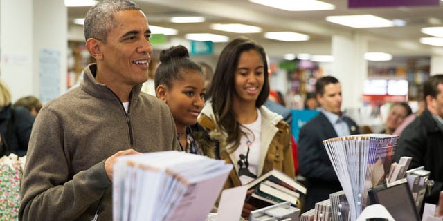 Nov. 29, 2014: President Obamashops with daughters, Sasha, center, and Malia, at Politics and Prose bookstore, in Washington, D.C.