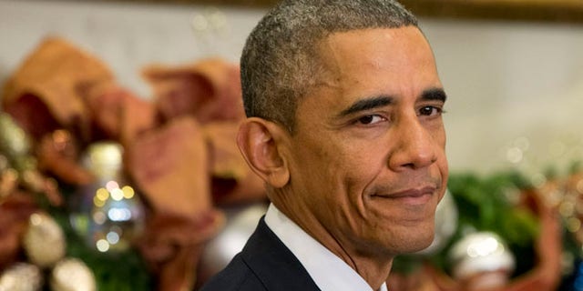 FILE: Dec. 5, 2014: President Obama in the Roosevelt Room of the White House, in Washington, D.C.