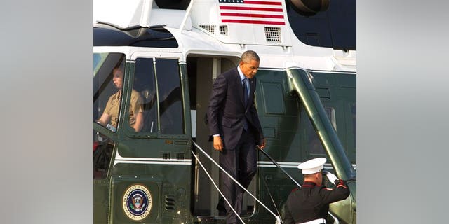 President Barack Obama steps of Marine One upon arrival at Andrews Air Force Base, Md., on Tuesday, July 29, 2014, en route to Kansas City, Mo. (AP Photo/Jose Luis Magana)