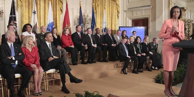 President Barack Obama, Vice President Joe Biden, his wife Jill Biden, and others, listen in the East Room of the White House on Tuesday, April 12, 2011, as first lady Michelle Obama delivers remarks to launch Joining Forces, the national initiative to support and honor America's service members and their families. (AP Photo/Pablo Martinez Monsivais)