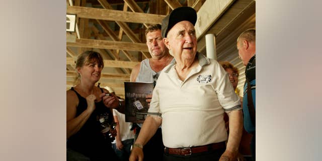 In this June 8, 2005, photo, Earl Baltes, right, is shown at Eldora Speedway in Rossburg, Ohio. Earl Baltes, the founder and longtime promoter of Eldora Speedway, has died. He was 93. Speedway officials say Baltes died Monday, March 23, 2015, at Miami Valley Hospital in Dayton, Ohio. Eldora owner and three-time NASCAR champion Tony Stewart says Baltes "was the yardstick other track promoters measured themselves by. He constantly raised the bar, and he did it by creating events everyone else was afraid to promote. He did them himself, too." (AP Photo/Dayton Daily News, Jan Underwood, File)