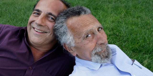 In this June 19, 2008 photo, brothers Ray, left, and Tom Magliozzi, co-hosts of National Public Radio's "Car Talk" show, pose for a photo in Cambridge, Mass. NPR says Tom Magliozzi died Monday, Nov. 3, 2014 of complications from Alzheimer's disease. He was 77. (AP Photo/Charles Krupa)
