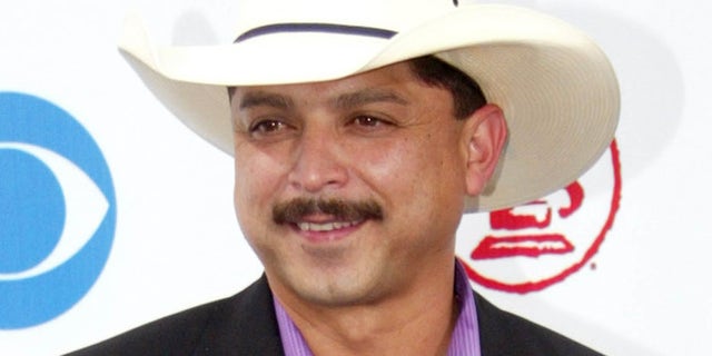 FILE - In this Sept. 3, 2003 file photo, Emilio Navaira arrives at the Latin Grammy Awards in Miami. The Grammy-winning Tejano star has died in New Braunfels, Texas. He was 53. Police in New Braunfels said in a statement Tuesday, May 17, 2017, that preliminary results indicate the entertainer died of natural causes. (AP Photo/Wilfredo Lee, file)