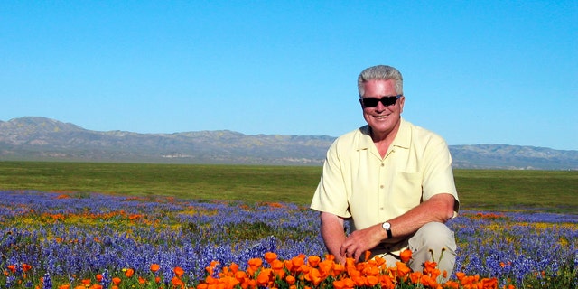 2005 FILE: TV host Huell Howser poses for a photo at the Antelope Valley California Poppy Reserve in Lancster, Calif.