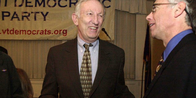 In this March 14, 2003, file photo, Sen. Jim Jeffords, I-Vt., center, laughs with Vermont Democratic Party Chairman Scudder Parker at the annual Democratic Party dinner in Montpelier, Vt.