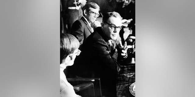 FILE - In this March 13, 1973 file photo, John T. Downey, a former Central Intelligence Agency agent who spent 20 years as a prisoner in China during the Cold War, speaks during a news conference in New Britain, Conn. The office of Connecticut Gov. Dannel P. Malloy said that Downey, who later served as a Connecticut judge, died Monday, Nov. 17, 2014. He was 84. (AP Photo/Bob Child, File)