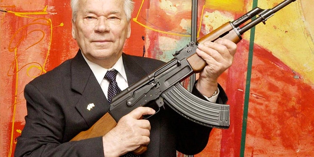 July 26, 2002 - FILE photo of Russian weapon designer Mikhail Kalashnikov presenting his legendary assault rifle to the media while opening the exhibition "Kalashnikov - legend and curse of a weapon" at a weapons museum in Suhl, Germany. Kalashnikov died at the age of 94.