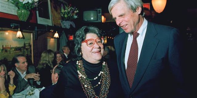 In this April 27, 1993 file photo, restaurateur Elaine Kaufman, left, stands with author George Plimpton at her restaurant "Elaines" in New York. (AP)
