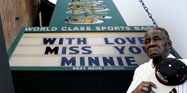 A sign displays at Sluggers sports bar in honor of Minnie Minoso on Sunday, March 1, 2015, in Chicago. Chicago White Sox legend Minnie Minoso passed away at age of 90. Minoso was the first black Cuban player in Major League Baseball and the first black player for the White Sox. (AP Photo/Nam Y. Huh)