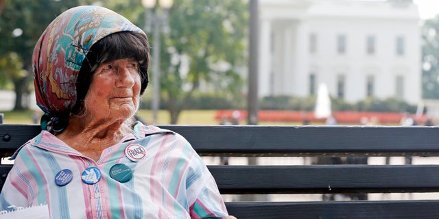 FILE - In this Sept. 12, 2013 file photo, Concepcion Picciotto, who holds a constant peace vigil in Lafayette Park across from the White House in Washington, sits on a park bench in the park. Picciotto, the protester who maintained a peace vigil outside the White House for more than three decades, a demonstration widely considered to be the longest-running act of political protest in U.S. history, has died. The Washington Post reports Picciotto died Monday, Jan. 25, 2016, at a housing facility for homeless women. She was believed to be 80. (AP Photo/Charles Dharapak, File)