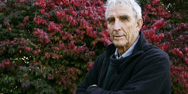 FILE - Writer Peter Matthiessen stands in the yard of his house in Sagaponack, N.Y. in this Oct. 28, 2004 file photo. Matthiessen, award-winning author of more than thirty books, world-renowned naturalist, explorer, Buddhist teacher, and political activist, died Saturday, April 5, 2014 after an illness of some months,according to his publisher Geoff Kloske of Riverhead Books. He was 86. (AP Photo/Ed Betz, File)