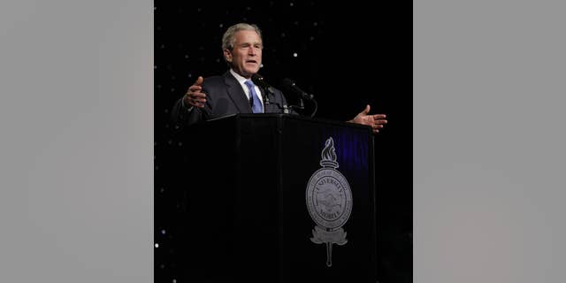 In a photo provided by the University of Mobile, former President George W. Bush addresses the 6th-annual University of Mobile Leadership Banquet at the Arthur Outlaw Convention Center Thursday, Oct.7, 2010 in Mobile, Ala. (AP Photo/University of Mobile)