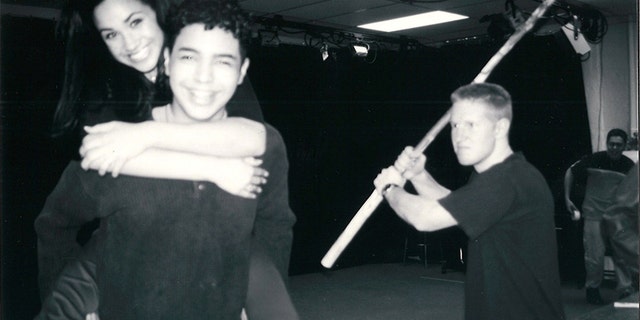 The young actors take a break between rehearsals. Megan hitches a ride on the back of a grinning Danny Segura, kid brother of her boyfriend Luis, while Brent Giannotta, who played a shepherd, makes a mock attack with his staff.