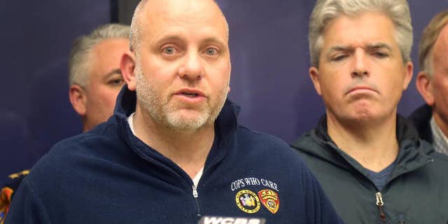 Noel DiGerolamo, left, President of the Suffolk County Police Benevolent Association, and Suffolk County Executive Steven Bellone, speak with reporters at a news conference at Stony Brook University Hospital, Thursday, March 12, 2015 in Stony Brook, N.Y. A Suffolk County police officer was shot and wounded while confronting a suspect who fled a traffic stop, police officials said. Officer Mark Collins, who is expected to survive, was in plain-clothes and driving an unmarked vehicle when he stopped a car for a vehicle and traffic violation on Route 25 in Huntington Station. A suspect is in custody. (AP Photo/Mike Balsamo)