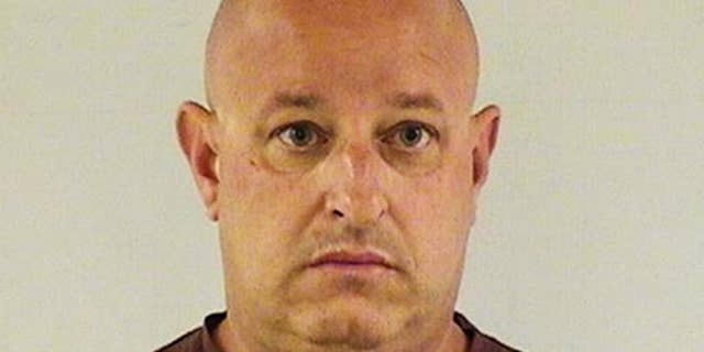 This undated photo provided by the Lake County Sheriff's Office shows Joseph A. Battaglia, a retired Chicago police officer who was arrested and charged with threatening investigators in the case of slain Fox Lake Police Lt. Charles Joseph Gliniewicz. Battaglia is scheduled to appear in court Tuesday, Sept. 15, 2015, in Waukegan, Ill., where a judge is expected to ask Battaglia if he's hired an attorney. At an initial hearing, he was told he doesn't qualify for a public defender. (Lake County Sheriff's Office via AP)