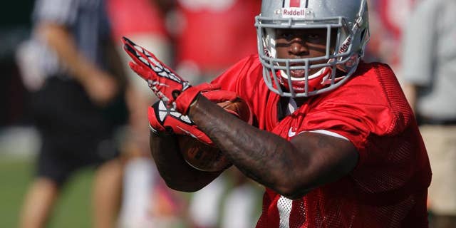 FILE - In this Aug. 9, 2014, file photo, Ohio State running back Rod Smith carries the ball during an NCAA college football practice in Columbus, Ohio. Rod Smith has left the Ohio State team to “deal with some personal issues.” Head coach Urban Meyer confirmed the speculated move on Tuesday, Oct. 28, 2014, in an email.(AP Photo/Jay LaPrete, File)