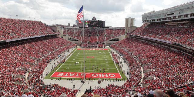 FILE - In this Sept. 21, 2013, file photo, Ohio State plays against Florida A&M at Ohio Stadium during an NCAA college football game in Columbus, Ohio. While Michigan has Michigan State and Indiana has Purdue and Notre Dame, Ohio State has no real big-time football competition within its borders. Or, at least, it hasn't for more than 90 years. The Buckeyes have won their last 38 meetings with other colleges from the state heading into Saturday’s game against Kent State. (AP Photo/Jay LaPrete, File)