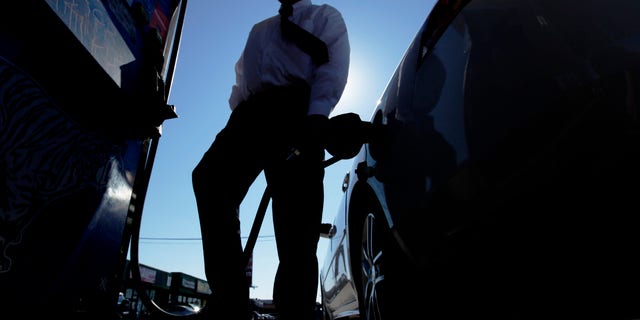 Feb. 16: Brian Sprague fills his his car's tank with gas in Philadelphia. Violent protests in the Middle East are keeping investors on edge about possible crude supply disruptions.