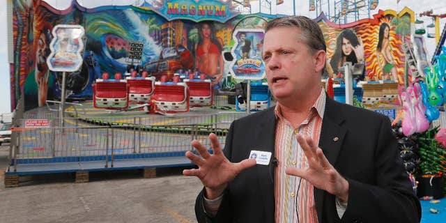 FILE - In this Wednesday, Sept. 10, 2014, file photo, Oklahoma Labor Commissioner Mark Costello speaks during a news conference at the state fairgrounds in Oklahoma City. Authorities say Costello has died after a stabbing at an Oklahoma City restaurant on Sunday, Aug. 23, 2015. (AP Photo/Sue Ogrocki, File)